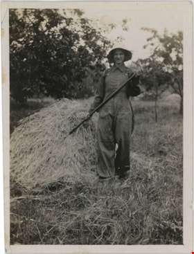Girlie Love raking hay, [192-] thumbnail