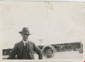Man standing with child, [191-] thumbnail