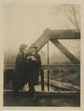 Frank Stanley with woman on bridge, [193-] thumbnail