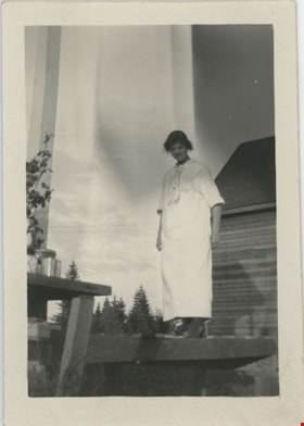 Esther Love Stanley standing on wooden platform, [191-] thumbnail