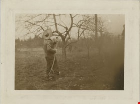 Jesse Love spraying fruit trees, [191-] thumbnail