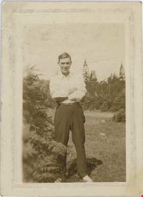 Young man standing in a clearing, [191-] thumbnail