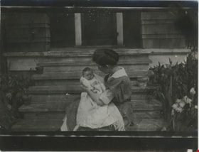 Woman holding baby, [between 1915 and 1925] thumbnail