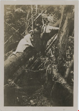 Two women and man in forest, [191-] thumbnail