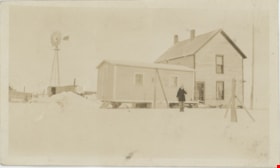 Child standing in front of farm house, [1927 or 1928] thumbnail