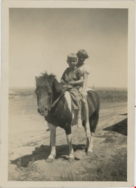 Don and Myrna riding pony, [193-] thumbnail