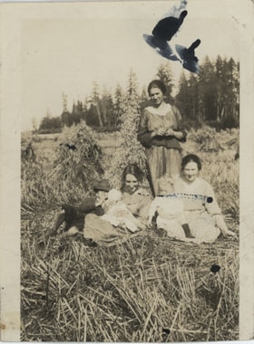 Women and children in hay field, [191-] thumbnail