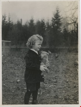 Kenneth McKenzie holding teddy bear, [between 1915 and 1917] thumbnail