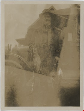Man in front of car with dead waterfowl, [191-] thumbnail