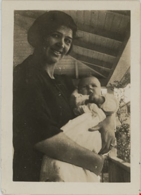 Esther Love Stanley holding infant, [192-] thumbnail