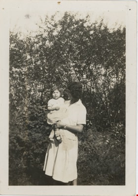 Esther Stanley holding young child, [between 1922 and 1932] thumbnail