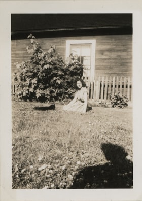 Joyce Stanley on ground with cat, [194-] thumbnail