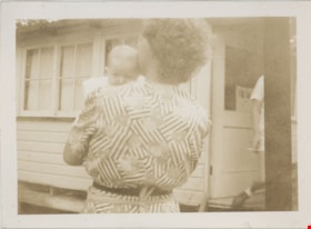 Woman holding infant child, [194-] thumbnail