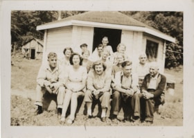 Group of people outside of small cabin, 194-] thumbnail
