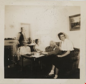 Family at table, [194-] thumbnail