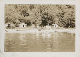 Swimmers in front of George and Rhoda Love's cottage, [192-] thumbnail
