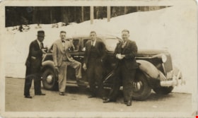 Four men standing with automobile, [193-] thumbnail