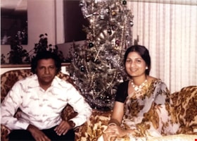 Nadeem and Surjeet Parmar in their home, [Dec. 1975] (date of original), copied [2023] thumbnail