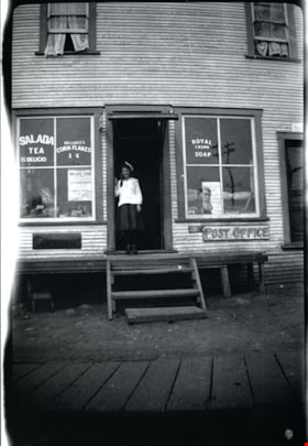 Gwendoline Goodridge standing in doorway of Goodridge store, [191-] thumbnail