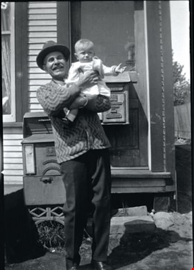 John Charles Goodridge holding grandchild, [between 1925 and 1935] thumbnail