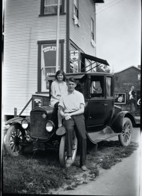 Alice Norman and Bill Goodridge seated on front of automobile, [between 1925 and 1935] thumbnail