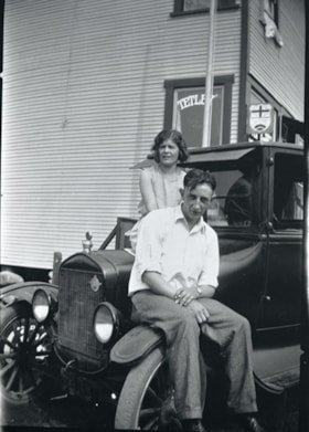 Alice and David Norman seated on front of automobile, [between 1925 and 1935] thumbnail
