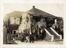 Charlie Rogers in front of family home, [194-] thumbnail