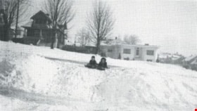 Historic view of the Frank Walsh Residence, 1949. (Children sledding near the house on Boundary Road. Historic Photo.) Copyright: City of Burnaby. Photo ID 447-032. thumbnail
